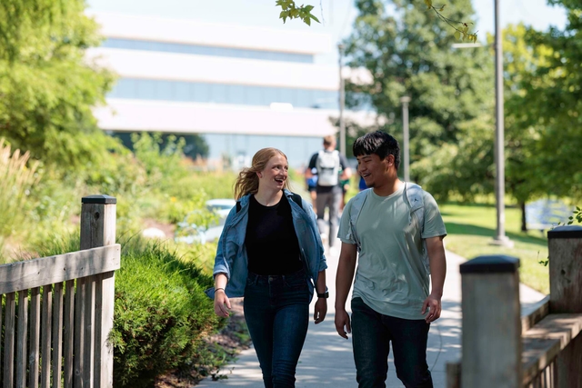 two students walking on campus
